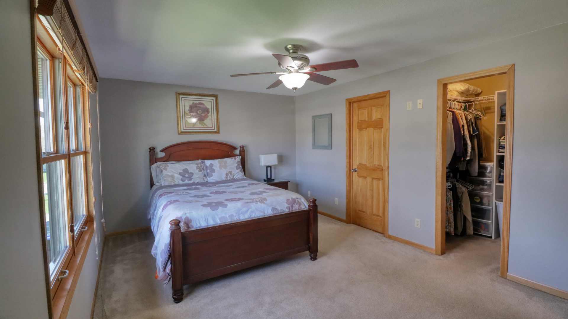 23 Cedar Court Bloomington, IL 61701 - Photo 23 of 36 a bedroom with a bed and a chandelier
