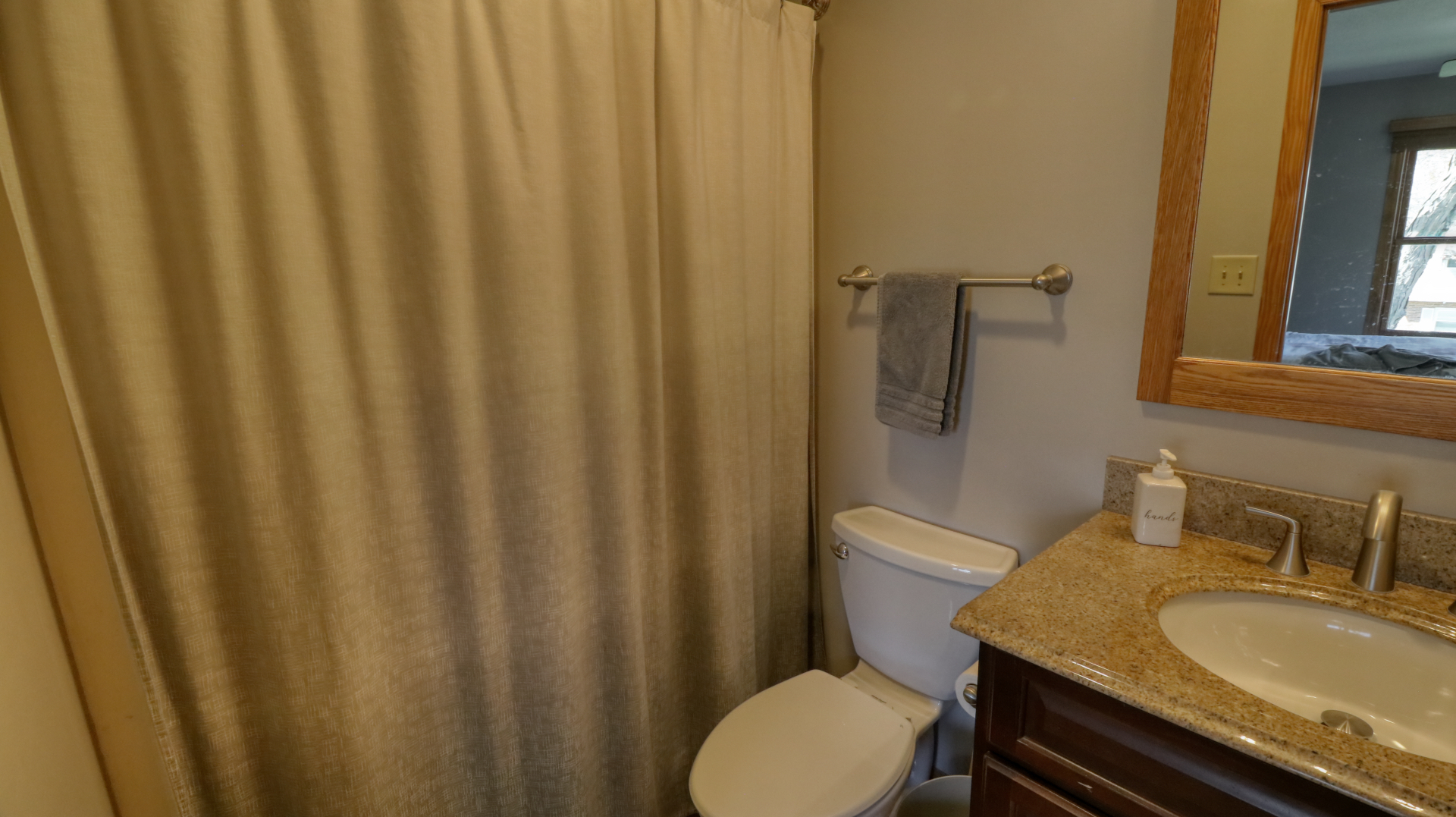 23 Cedar Court Bloomington, IL 61701 - Photo 25 of 36 a bathroom with a granite countertop sink toilet and a mirror