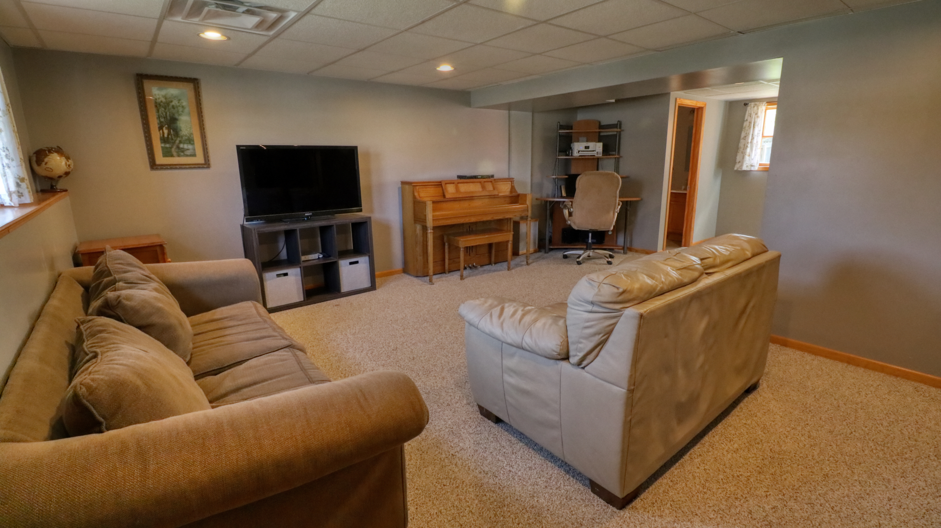 23 Cedar Court Bloomington, IL 61701 - Photo 26 of 36 a living room with furniture and a flat screen tv