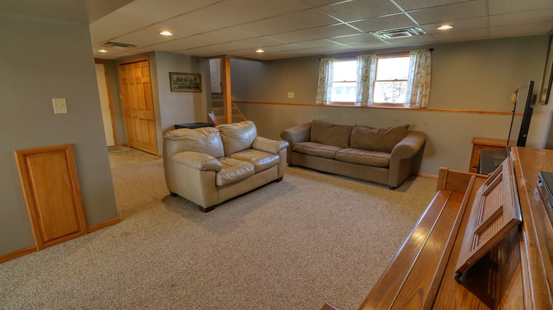 23 Cedar Court Bloomington, IL 61701 - Photo 29 of 36 a living room with furniture and a flat screen tv
