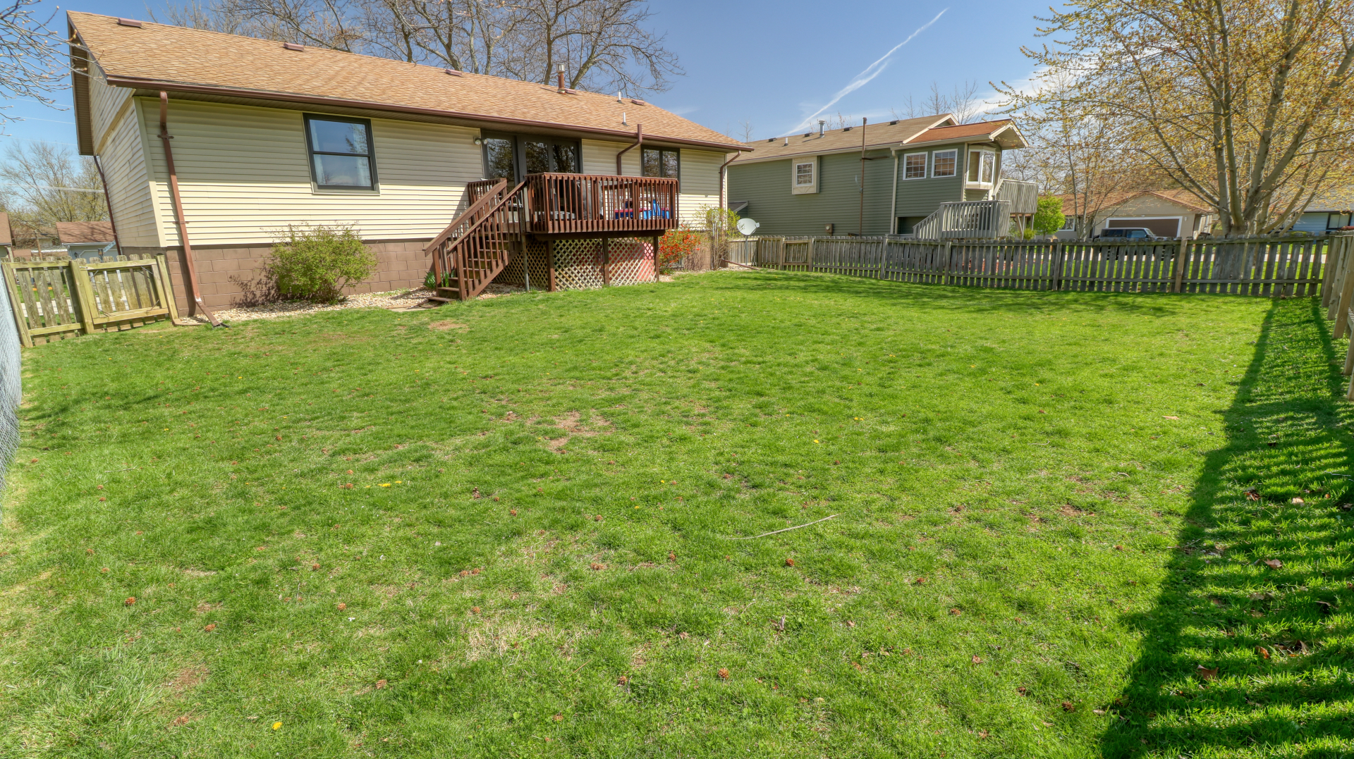 23 Cedar Court Bloomington, IL 61701 - Photo 32 of 36 a view of a house with a big yard and a large tree