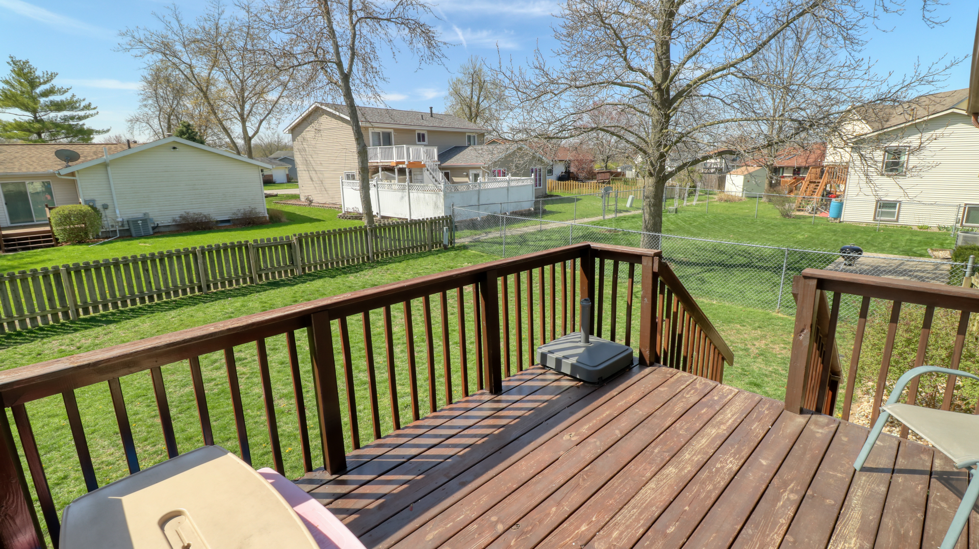 23 Cedar Court Bloomington, IL 61701 - Photo 34 of 36 a view of balcony with wooden floor and fence