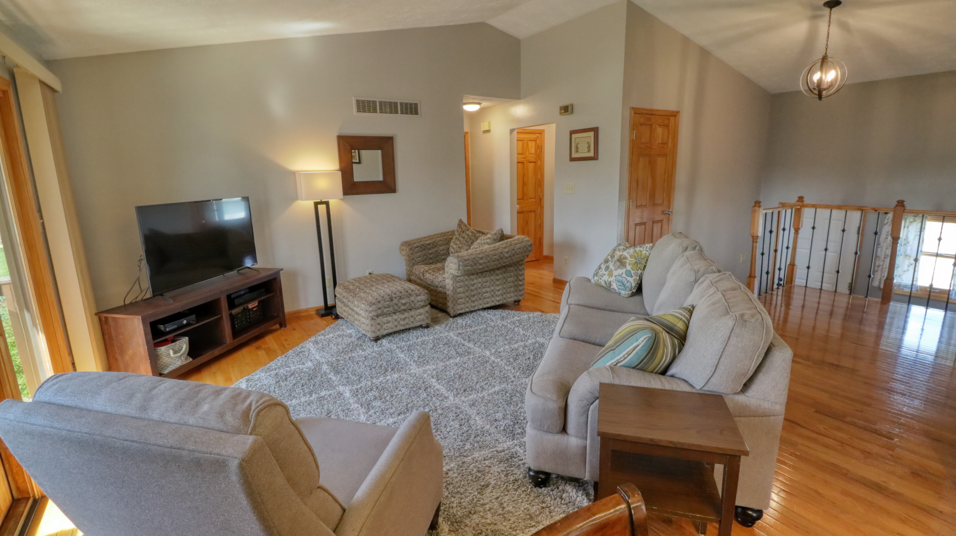 23 Cedar Court Bloomington, IL 61701 - Photo 7 of 36 a living room with furniture and a flat screen tv