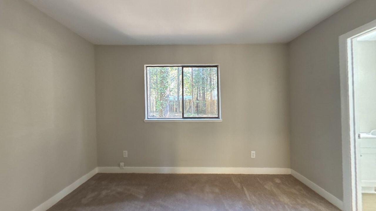 8353 Starlite Pines Road Shingletown, CA 96088 - Photo 11 of 30 an empty room with a window