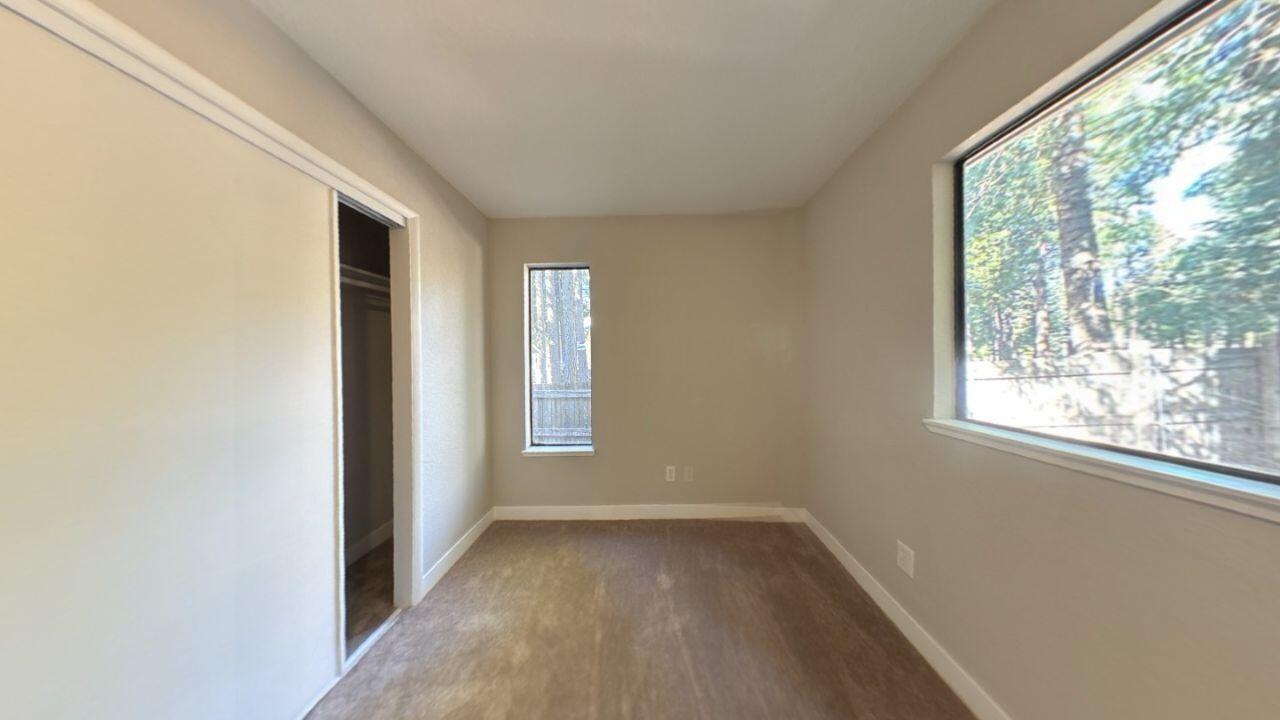 8353 Starlite Pines Road Shingletown, CA 96088 - Photo 15 of 30 an empty room with windows