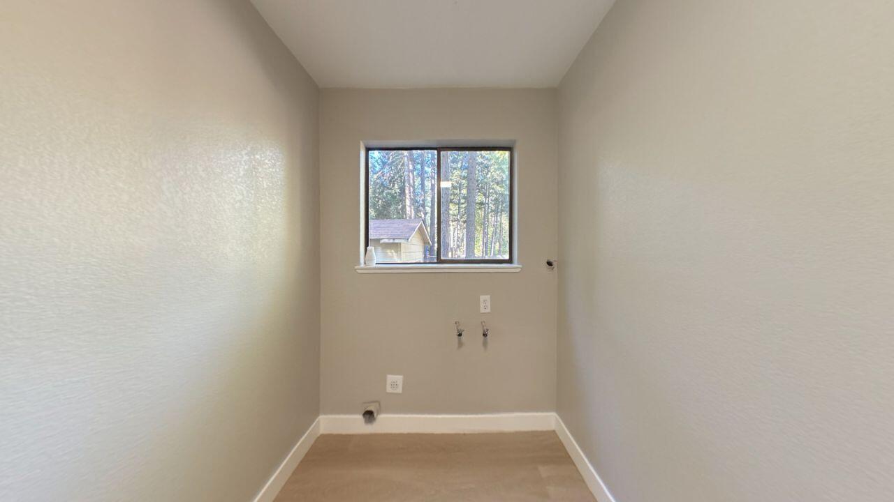8353 Starlite Pines Road Shingletown, CA 96088 - Photo 8 of 30 a view of a small space with wooden floor and a window