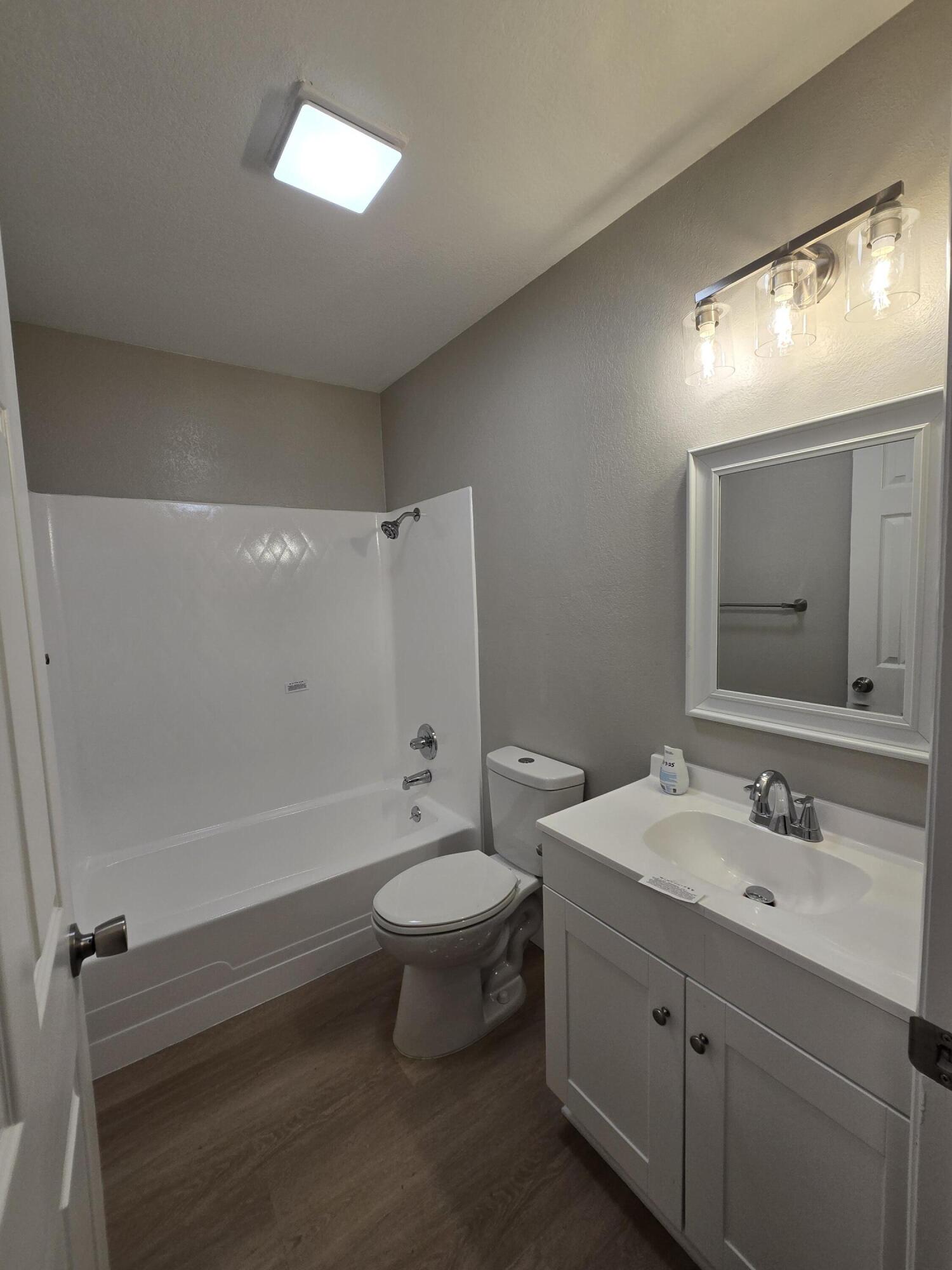 8353 Starlite Pines Road Shingletown, CA 96088 - Photo 10 of 30 a bathroom with a double vanity sink toilet and mirror