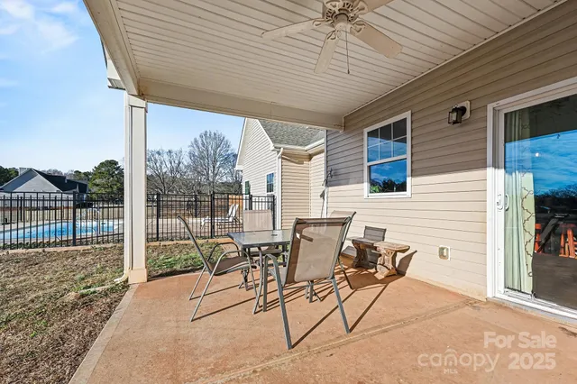 a view of a patio with a table and chairs