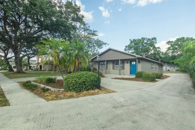 a front view of house with yard and green space