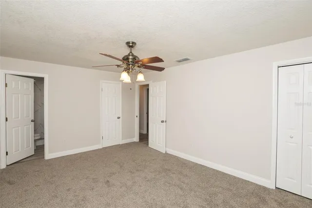 a view of a chandelier fan in a room