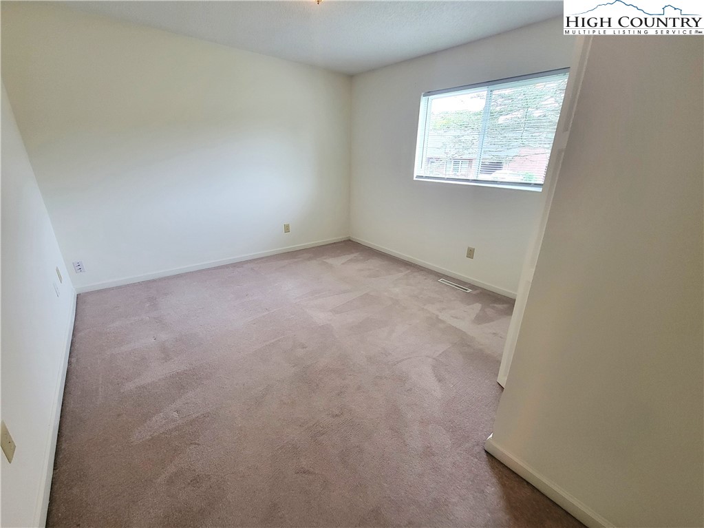 139 Wey Street Boone, NC 28607 - Photo 11 of 25 an empty room with windows