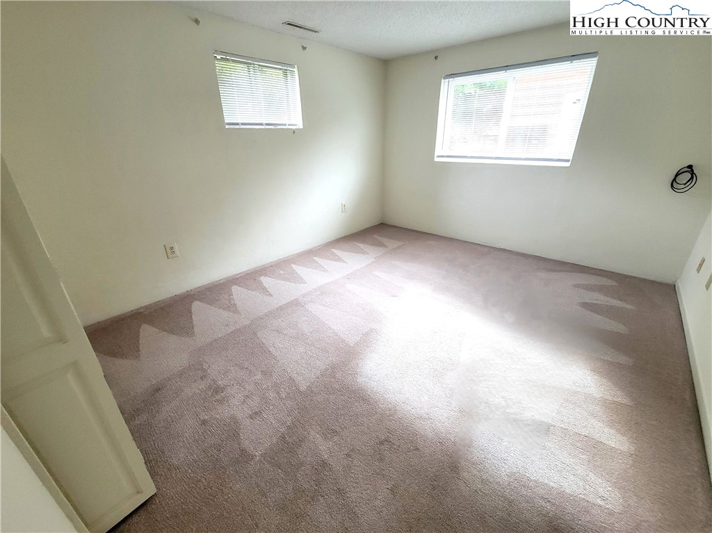 139 Wey Street Boone, NC 28607 - Photo 18 of 25 an empty room with windows