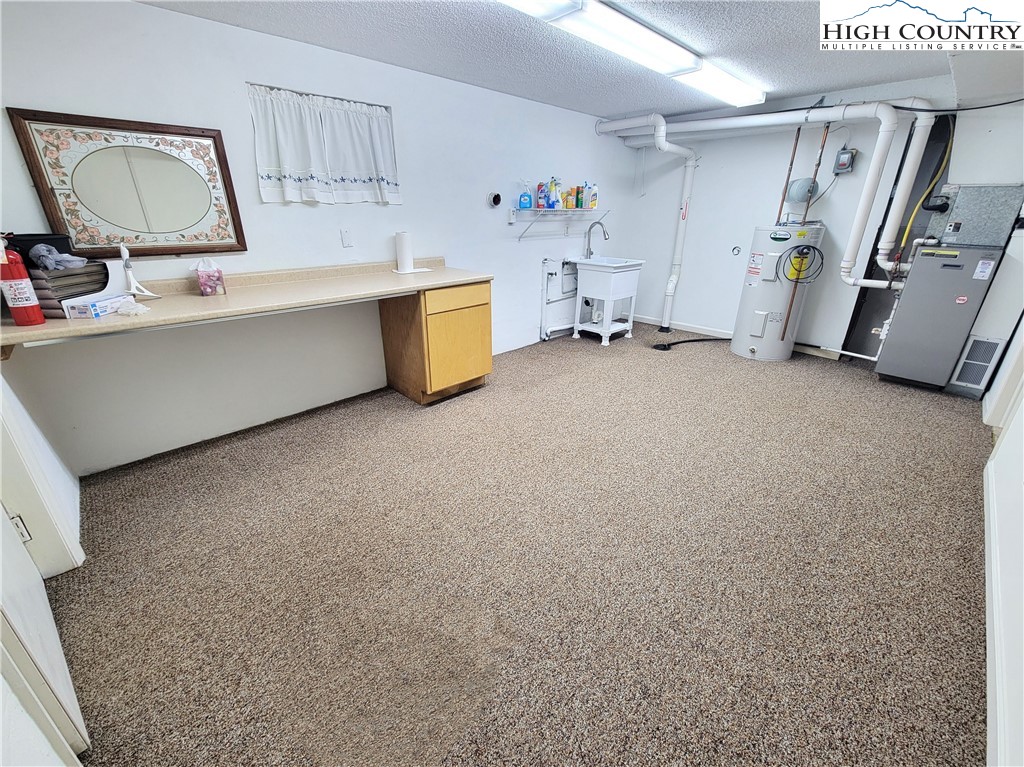 139 Wey Street Boone, NC 28607 - Photo 19 of 25 a view of kitchen with furniture and a flat screen tv