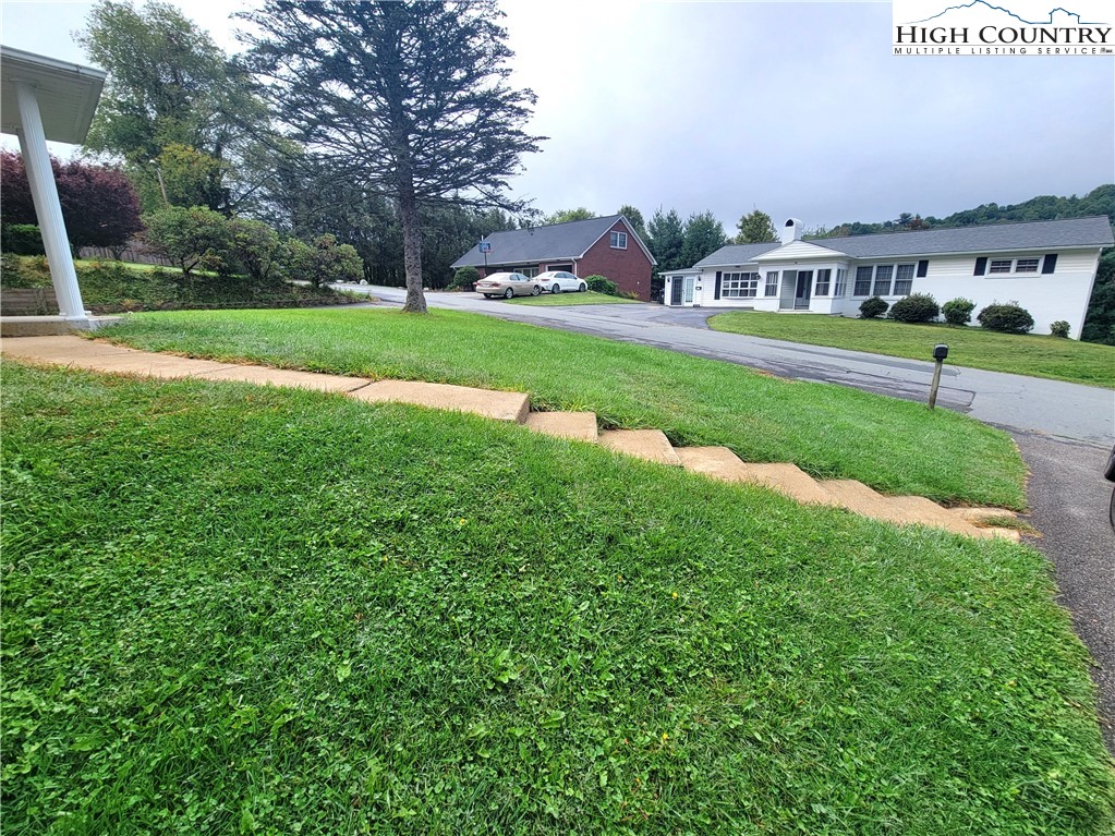 139 Wey Street Boone, NC 28607 - Photo 3 of 25 a view of a city with tall buildings and a big yard