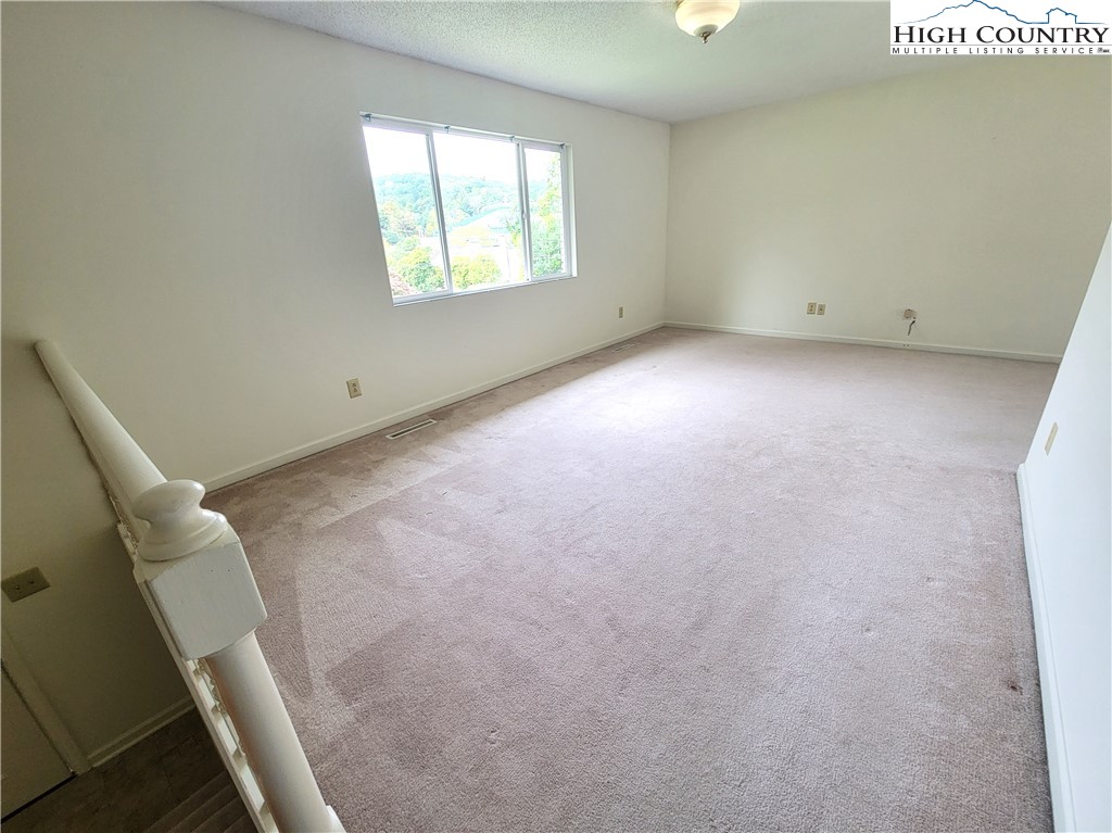 139 Wey Street Boone, NC 28607 - Photo 5 of 25 a view of an empty room with a window