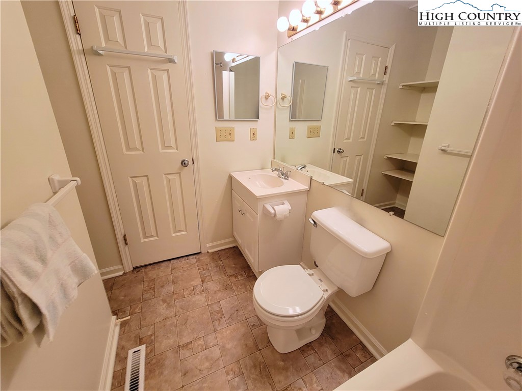 139 Wey Street Boone, NC 28607 - Photo 10 of 25 a white toilet sitting next to a bathroom sink