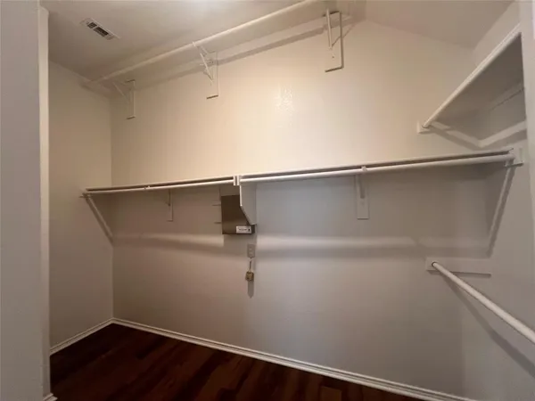 a view of an empty walk in closet