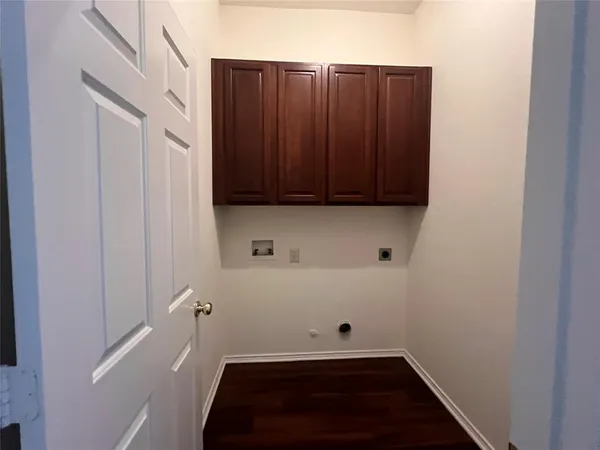 a room with a window and a wooden door