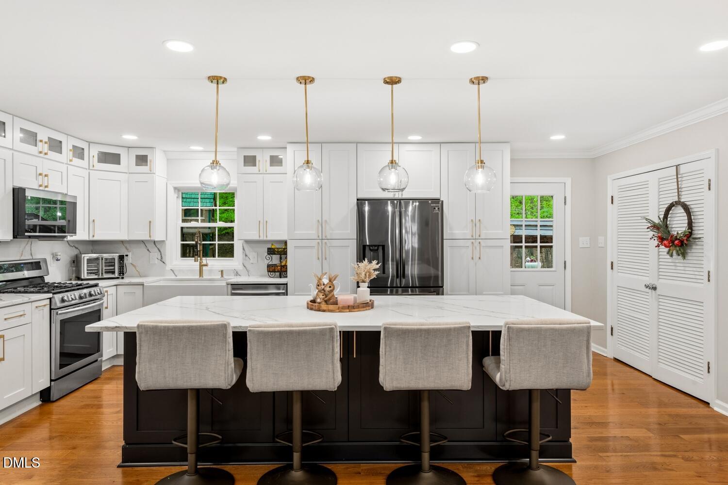 3200 Seven Springs Road Hillsborough, NC 27278 - Photo 2 of 37 a view of kitchen with stainless steel appliances kitchen island dining table and chairs
