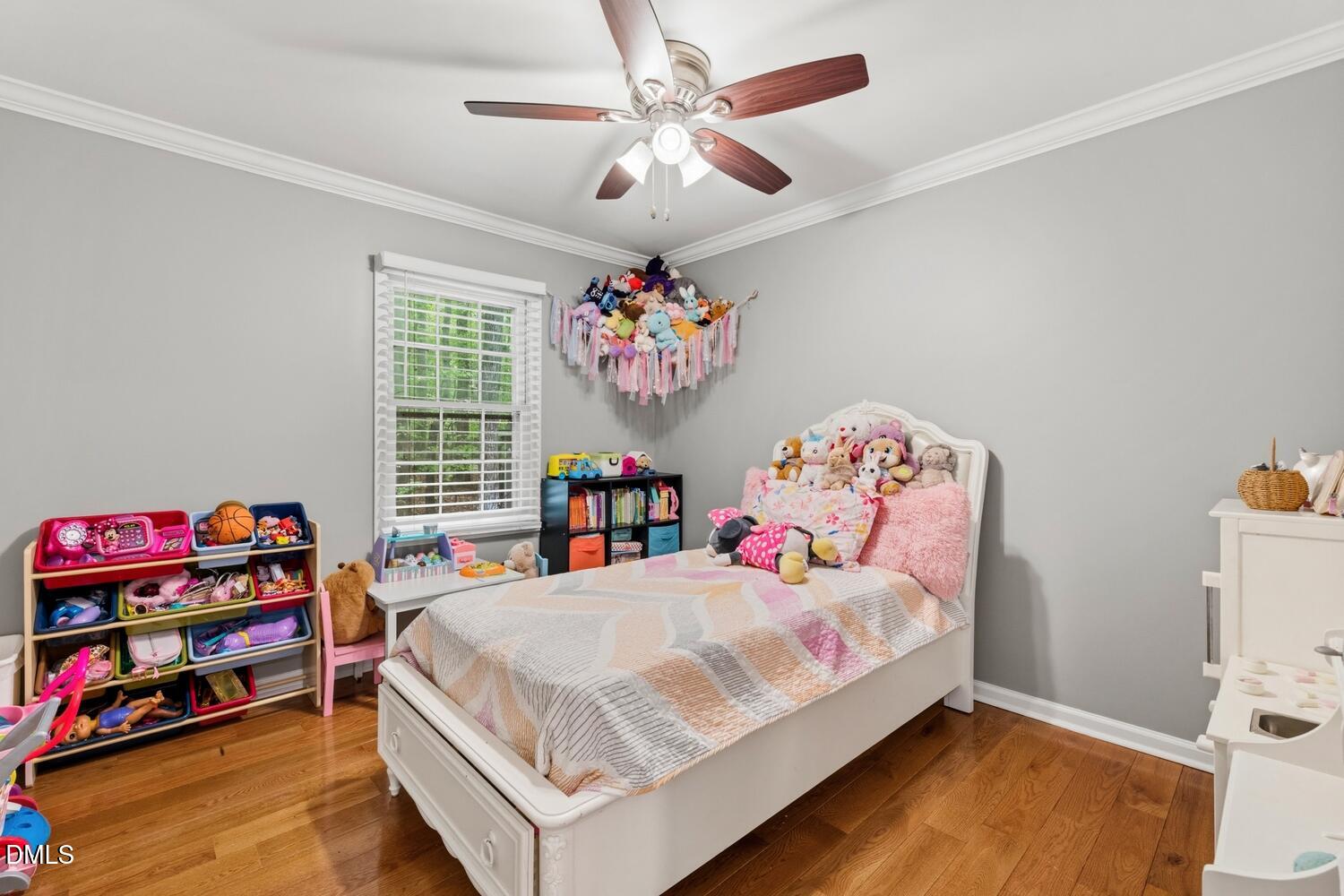 3200 Seven Springs Road Hillsborough, NC 27278 - Photo 8 of 37 a bedroom with a bed and a chandelier