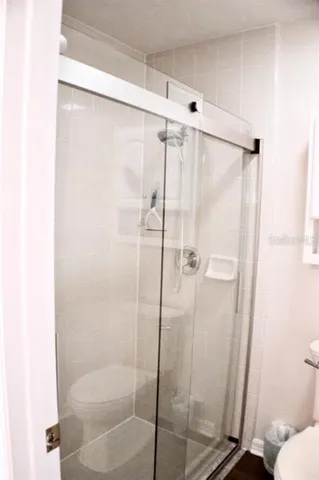 a bathroom with a tub and a large window