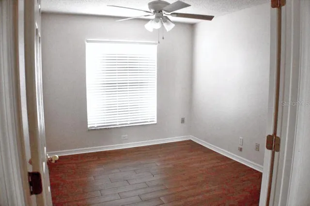 a view of a small space with wooden floor