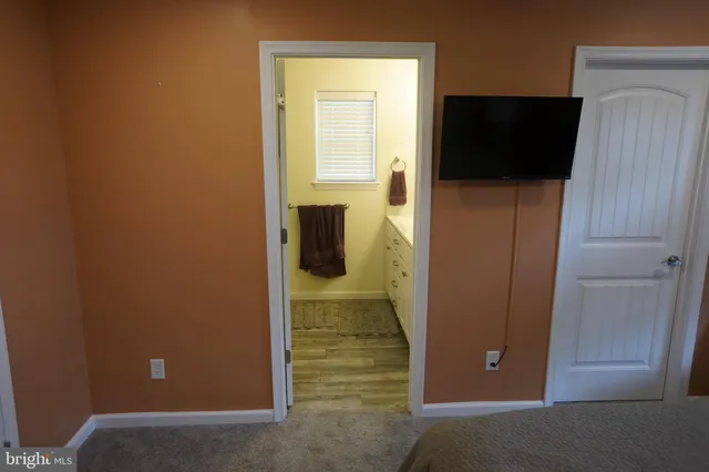 a view of a livingroom with wooden floor
