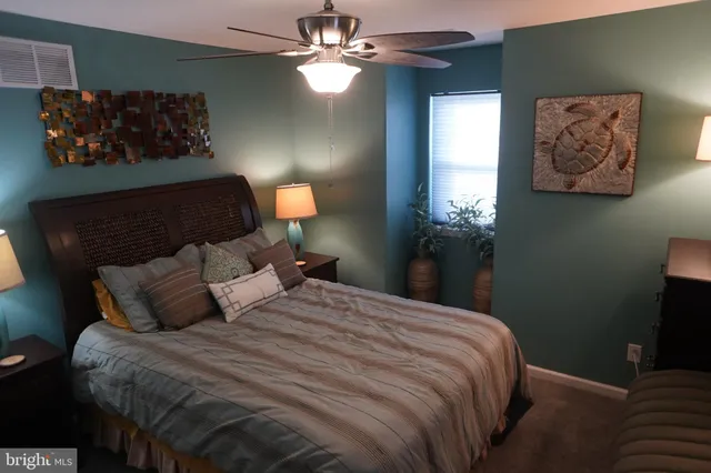 a bedroom with bed and window