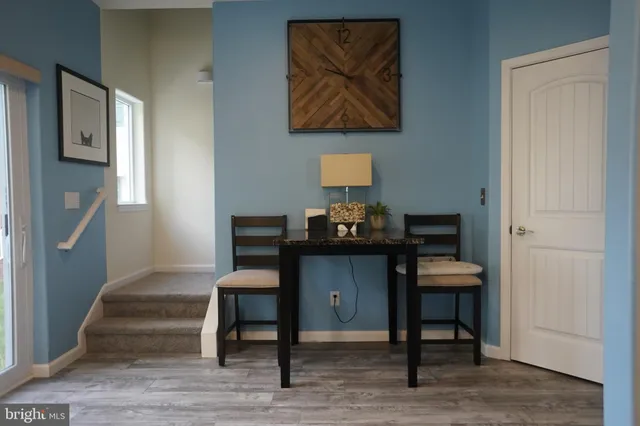 a workspace with furniture and wooden floor