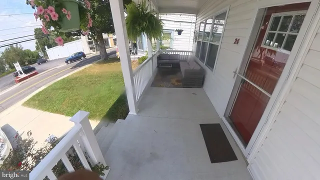 a view of a two chairs in the balcony