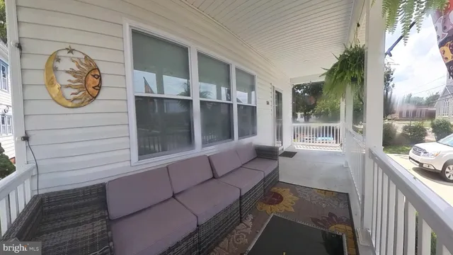a view of a house with backyard sitting area and garden