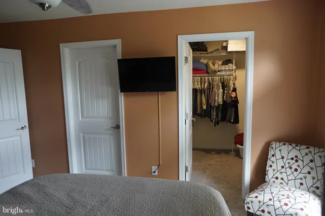 a bedroom with a bed and a view of bedroom