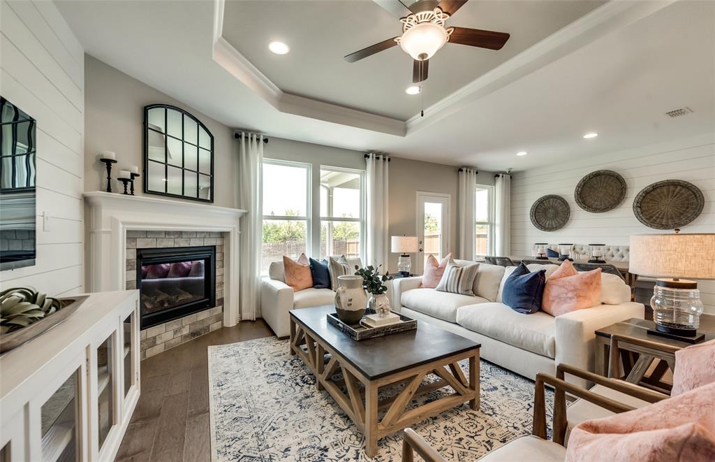 1608 Kendell Street Anna, TX 75409 - Photo 12 of 28 a living room with furniture and a fireplace