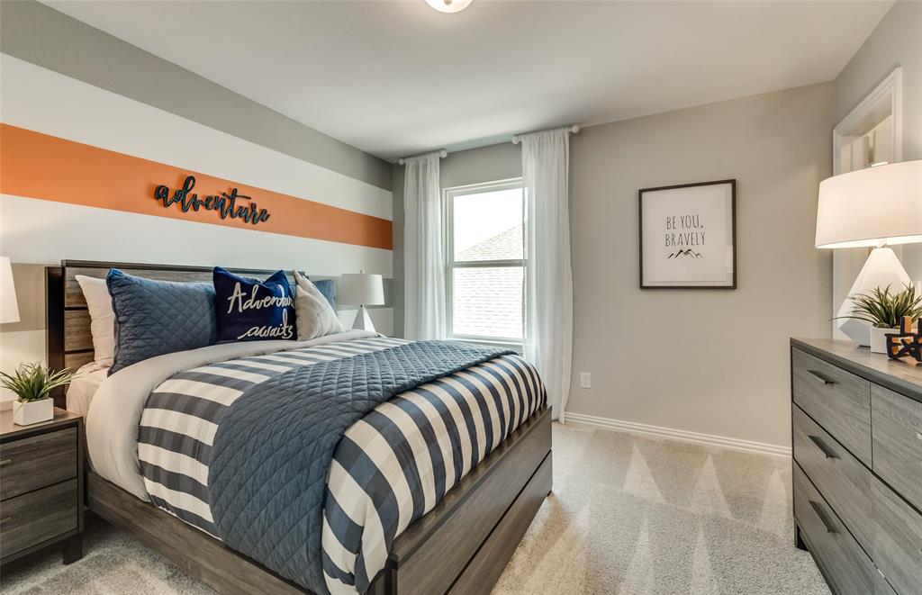 1608 Kendell Street Anna, TX 75409 - Photo 21 of 28 a bedroom with a large bed and a dresser