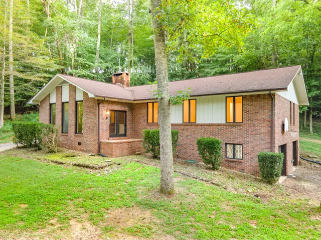 a backyard of a house with lots of green space