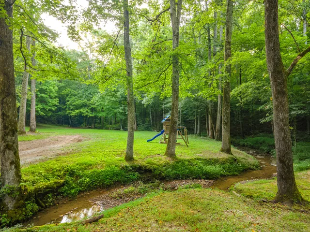 a view of a big room with air conditioner duct and materials on floor