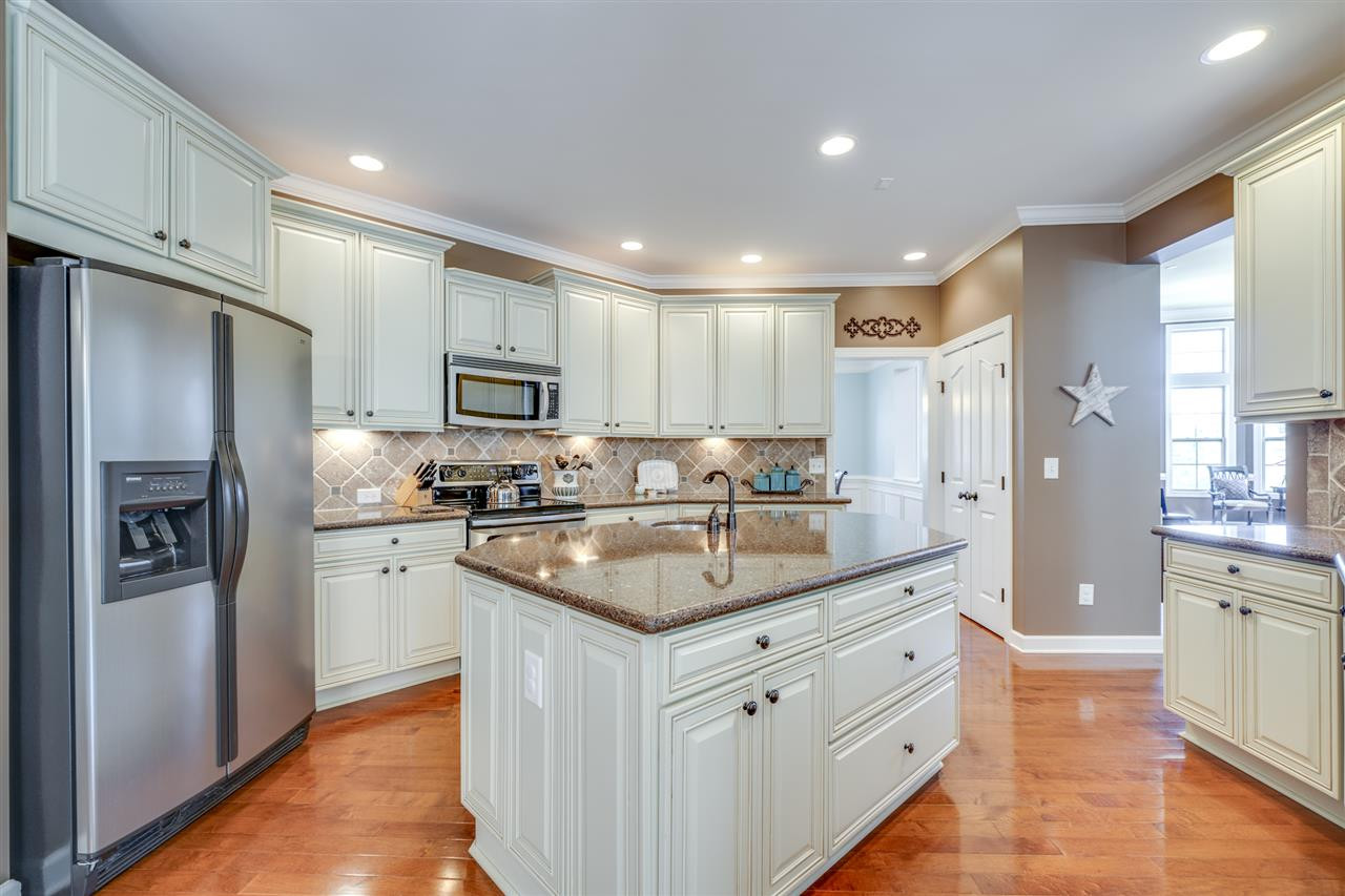 401 Rensford Place Cary, NC 27513 - Photo 9 of 30 Stainless Steel appliances & custom tile backsplash Kitchen