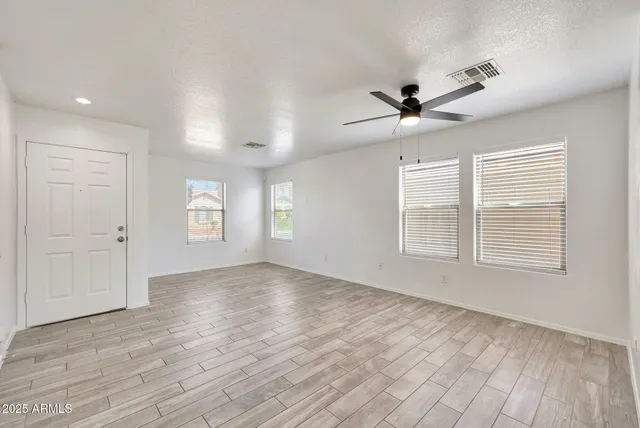 a view of an empty room with a window