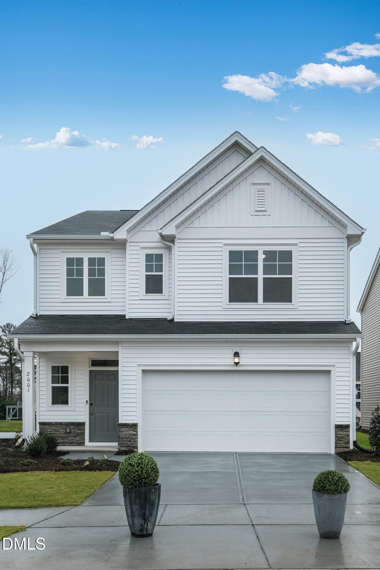 1028 Red Finch Way Angier, NC 27501 - Photo 2 of 40 a front view of a house with garage
