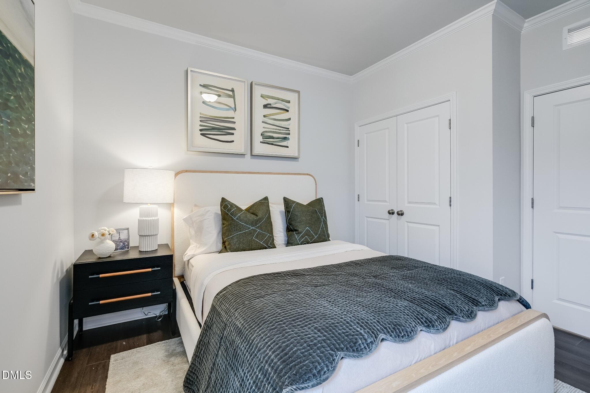 1028 Red Finch Way Angier, NC 27501 - Photo 21 of 40 a bedroom with a bed and a night stand