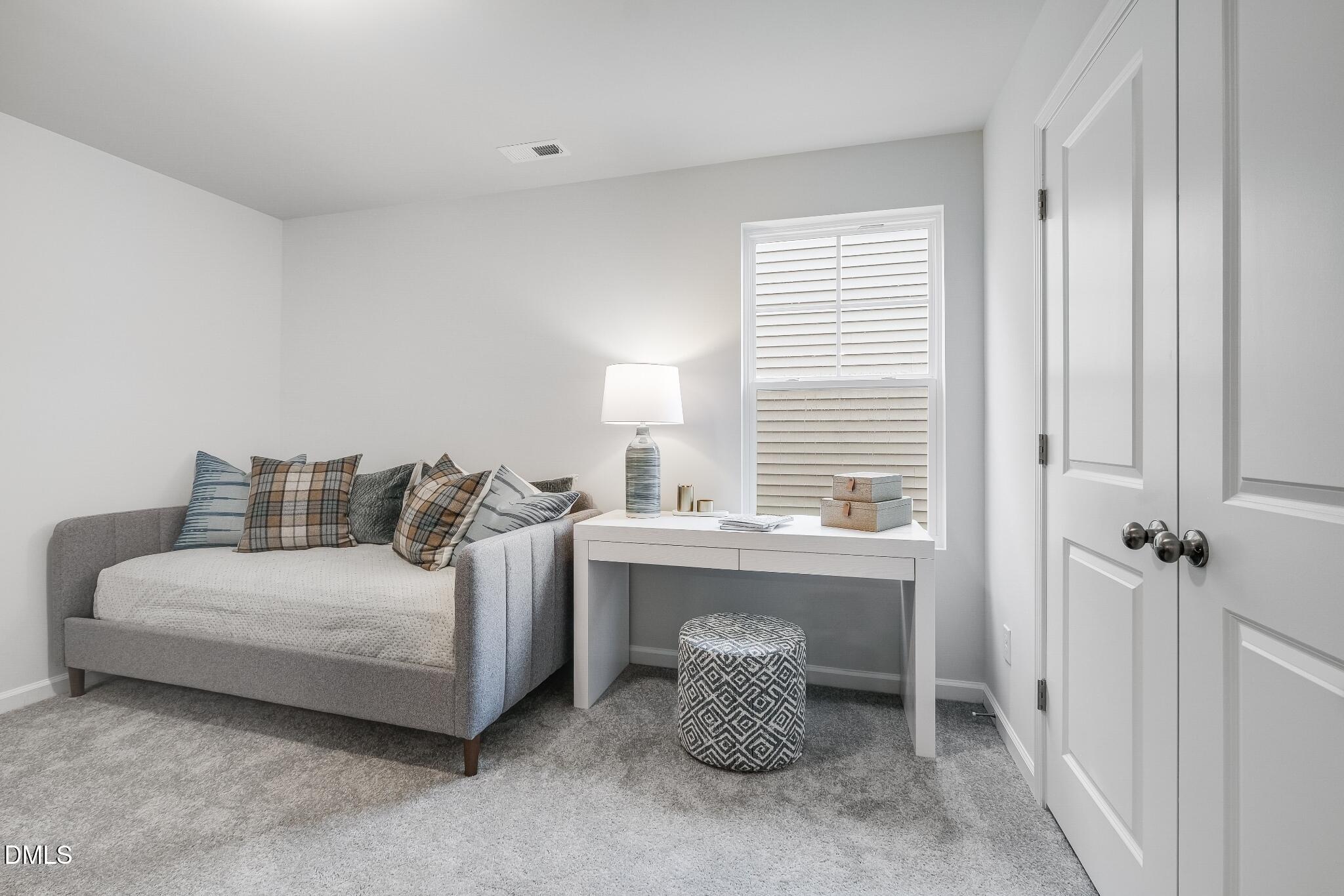 1028 Red Finch Way Angier, NC 27501 - Photo 22 of 40 a room with a bed and a table