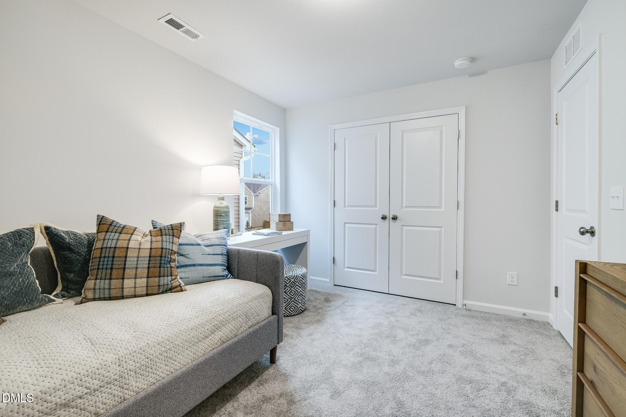 1028 Red Finch Way Angier, NC 27501 - Photo 23 of 40 a bedroom with bed and window