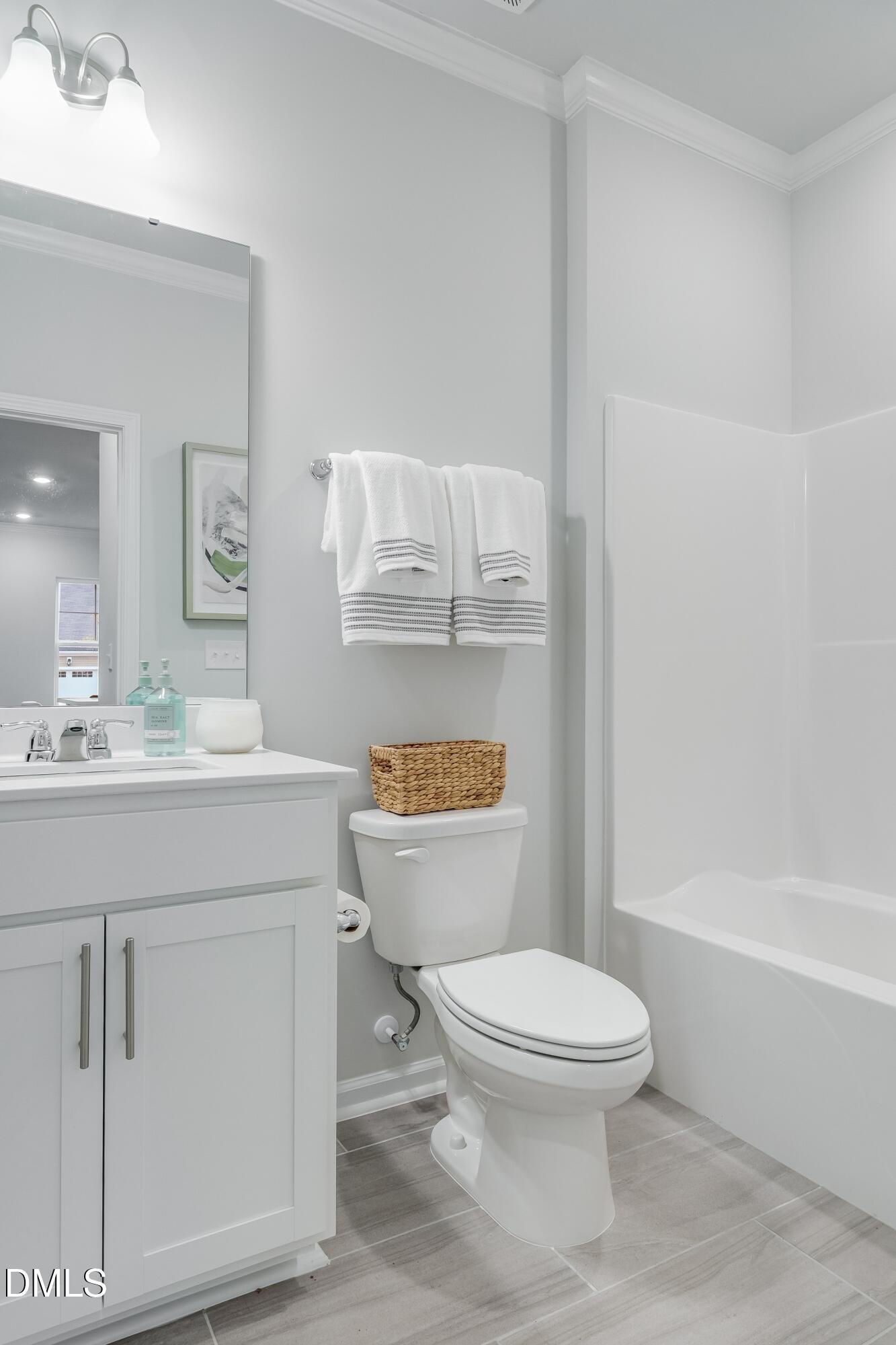 1028 Red Finch Way Angier, NC 27501 - Photo 30 of 40 a bathroom with a toilet a sink and bathtub