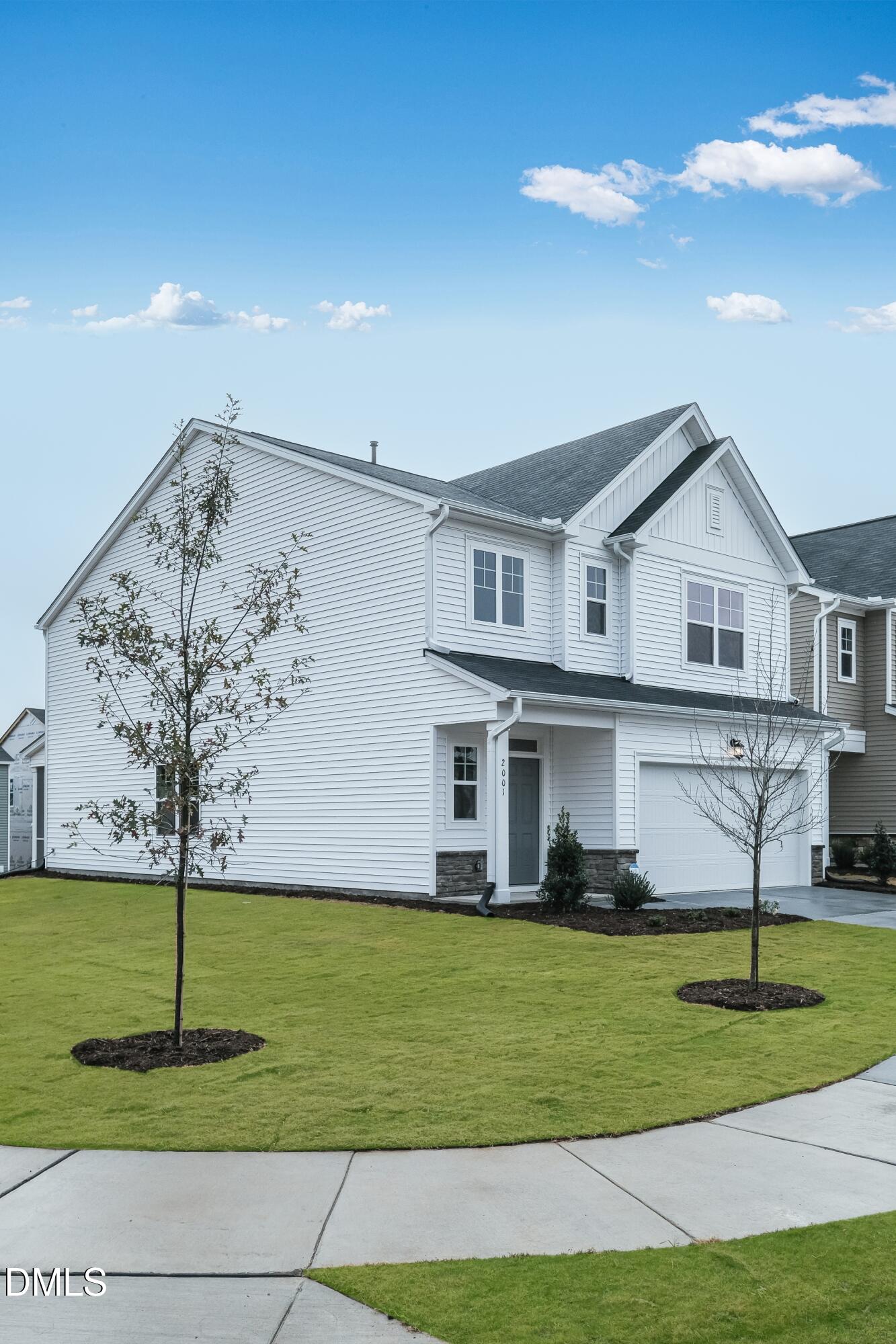 1028 Red Finch Way Angier, NC 27501 - Photo 3 of 40 a front view of a house with a yard