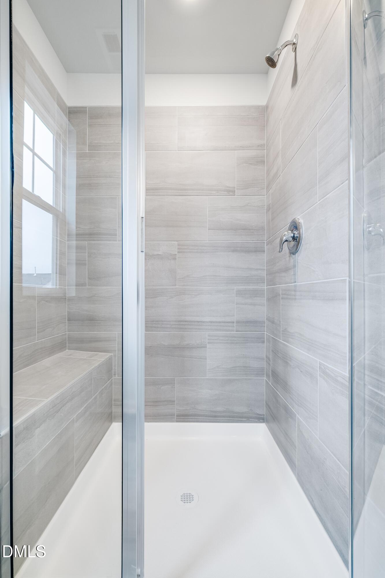 1028 Red Finch Way Angier, NC 27501 - Photo 33 of 40 a bathroom with a bathtub