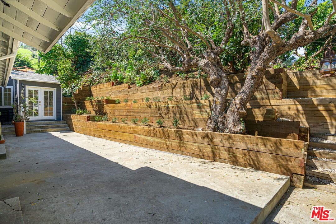 3919 South Ridgeley Drive Los Angeles, CA 90008 - Photo 21 of 23 a view of residential house with wooden stairs