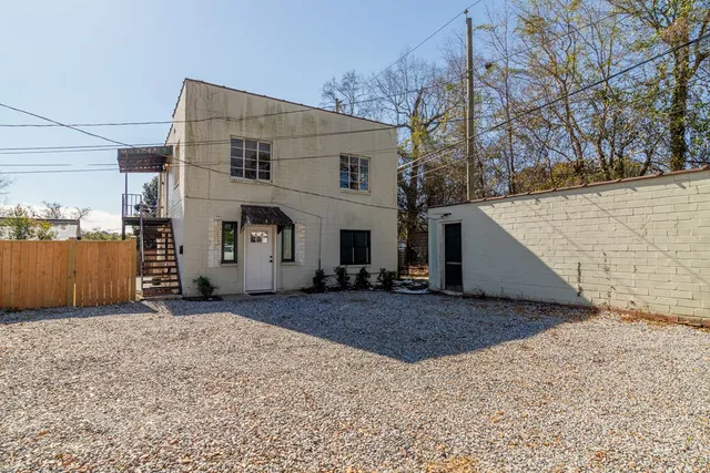 a view of a house with a snow in the yard