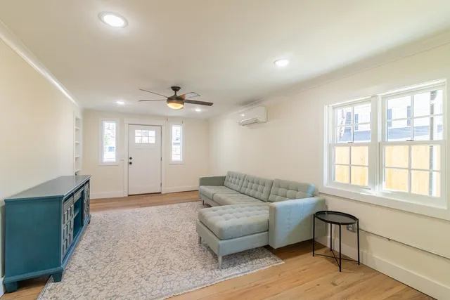 a living room with furniture and a window
