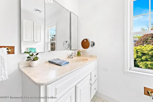 a kitchen with a sink and a window