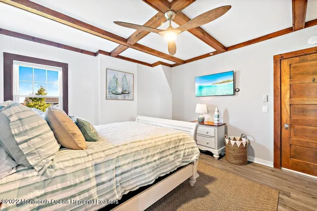 a bedroom with a bed and a couch